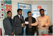 SimpleCall Managing Director Naufal Zamir presents a £3717.25 check to an Islamic Relief UK representative. The funds were raised by SimpleCall customers during an August promo.